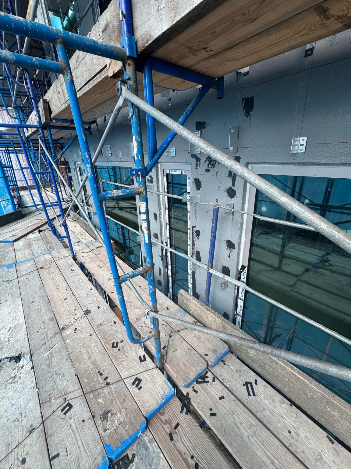 Exterior window installation from scaffold at 179 N 10