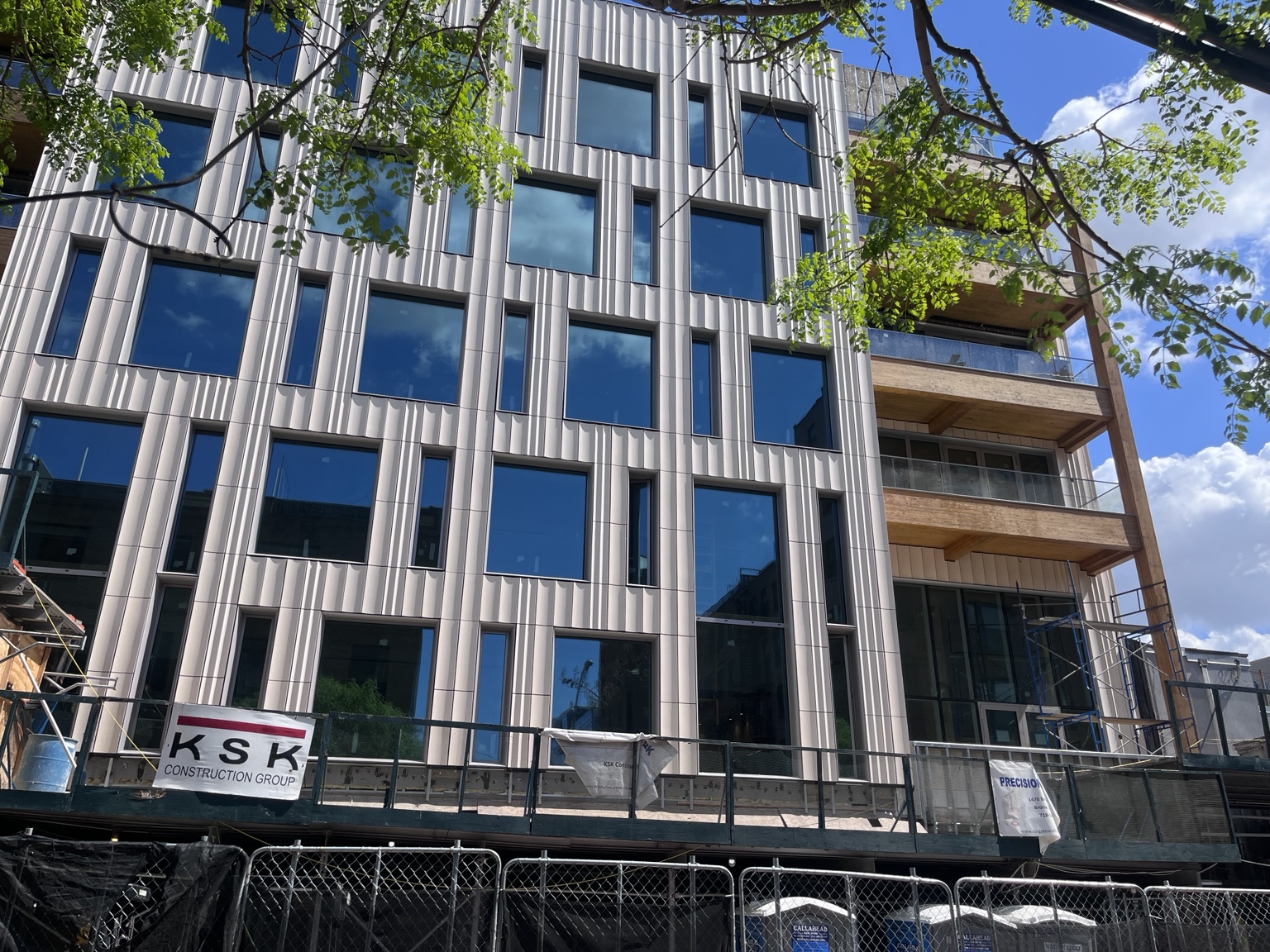 Exterior windows, metal panels, and balcony glazing at 179 N 10