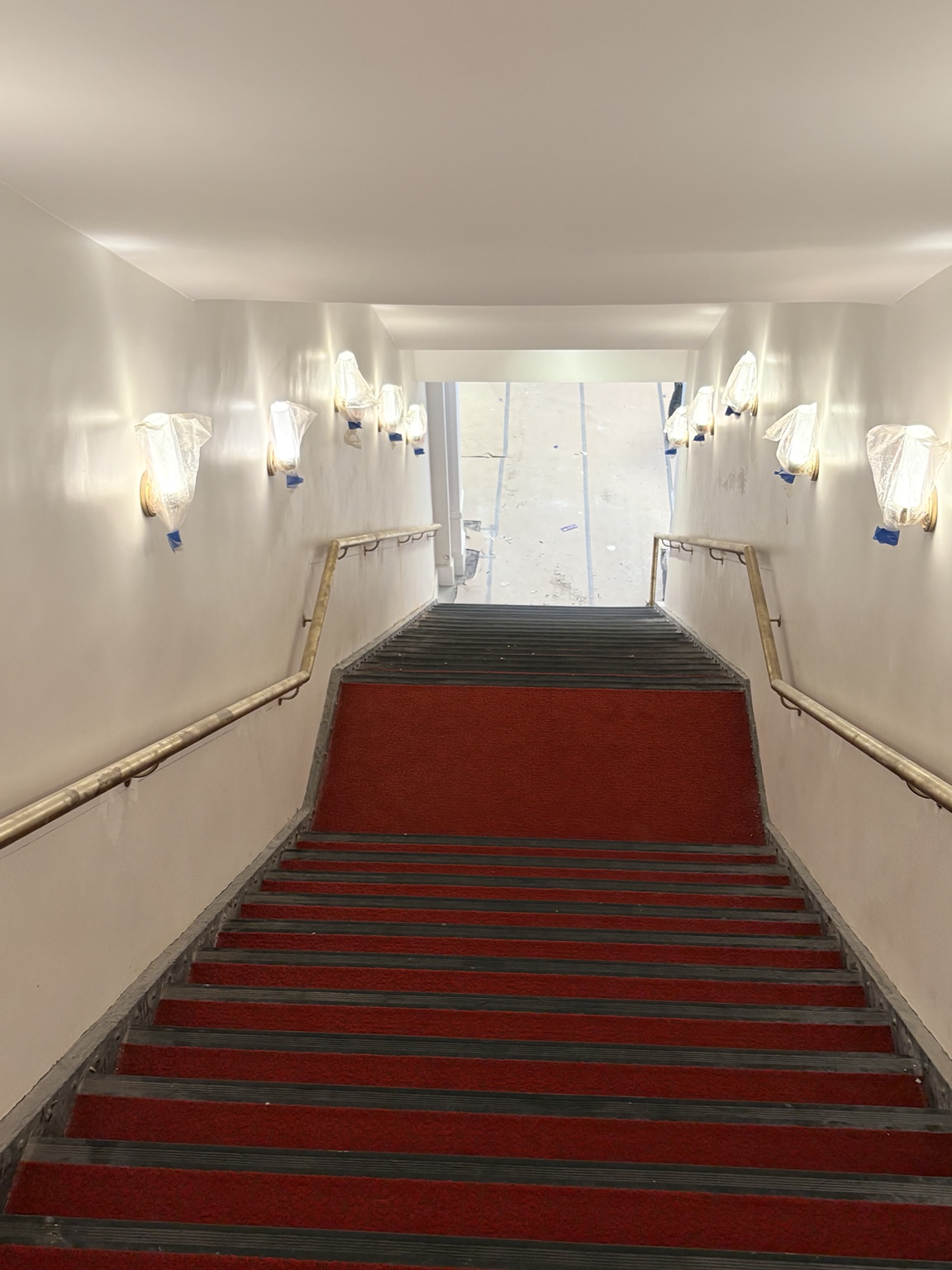 Full-height view of an Apollo Theater staircase and decorative railings